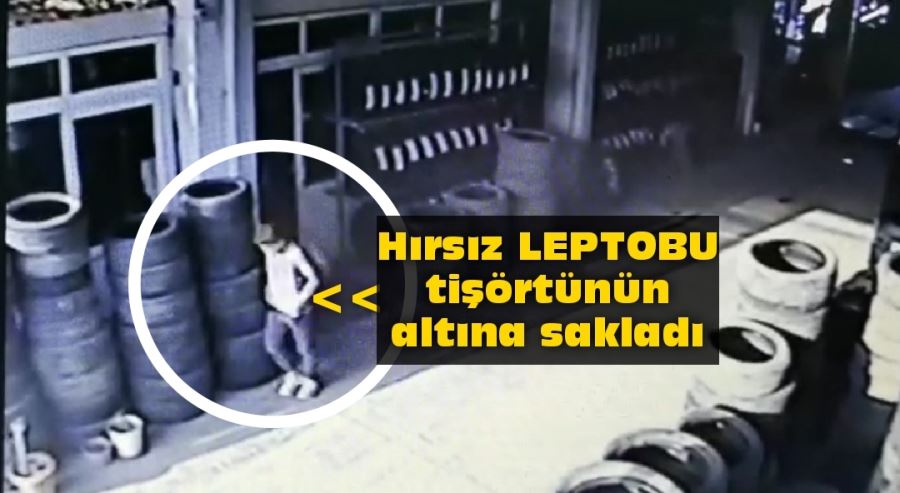 Dizüstü bilgisayarı tişörtünün içine saklayıp çaldı